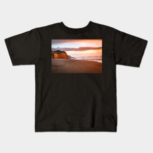 A cliff at sunset Kids T-Shirt